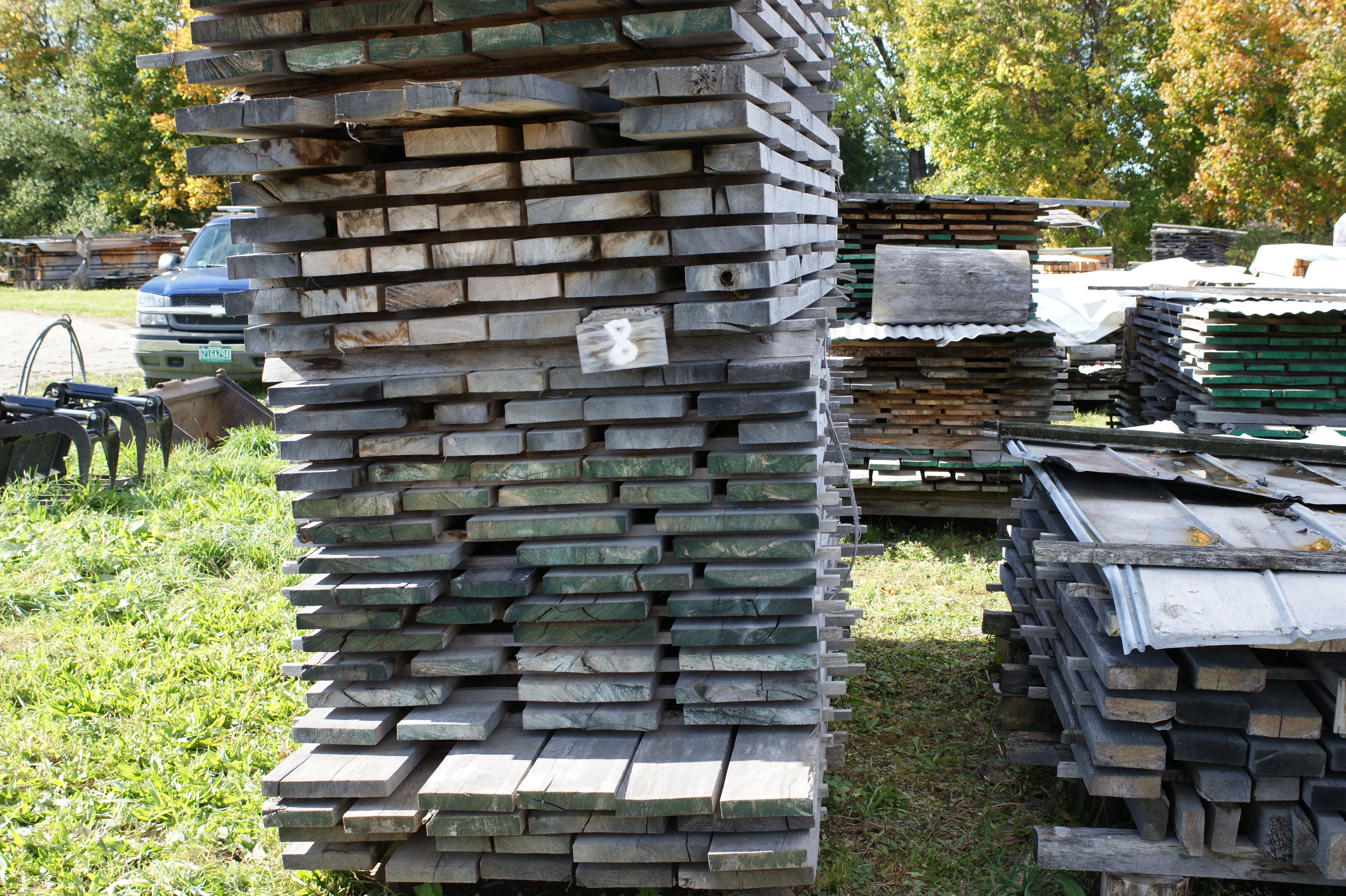 Stack of planks and assorted lumber/timber.