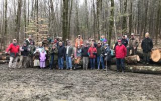 A large group gathered for a tour of timber harvest at the Stone property in Wallingford, VT. The warm wet winter day shut down logging for the remainder of the season.